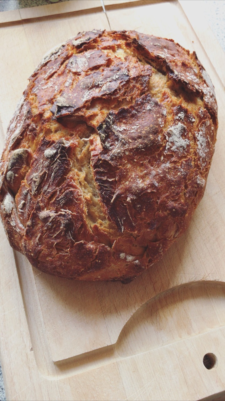 Loaf #7, whole, on a wooden board